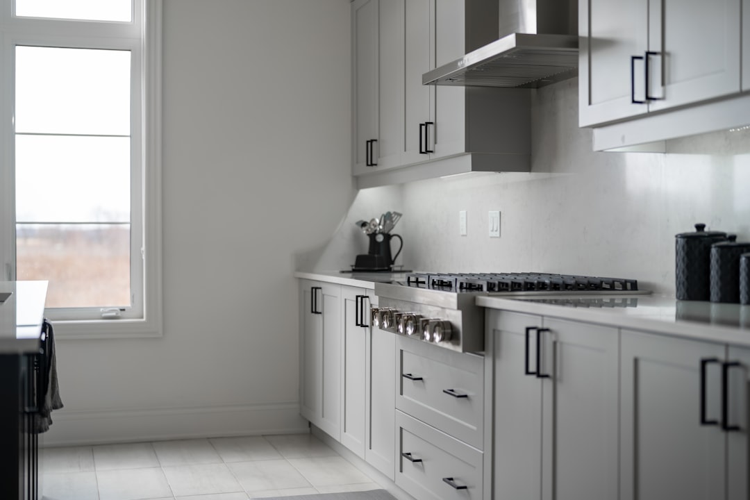 modern-white-kitchen-with-stainless-steel-appliances-7rpcpzair18